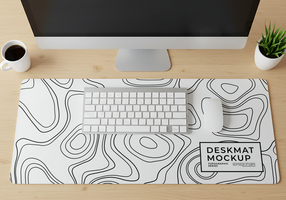 A minimalist desk setup featuring a topographic desk mat keyboard and mouse psd