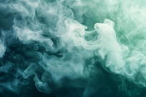 Teal and white smoke creating abstract shapes on dark background photo