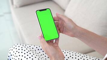 Hands of Woman Interacting with Smartphone close-up, Green Screen Chromakey, Tapping Touch screen, Exploring Mobile Interface, Digital Technology, Online Connection, App Personalization Concept video