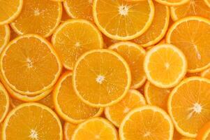 Freshly sliced oranges arranged beautifully on a surface inviting vibrant photo