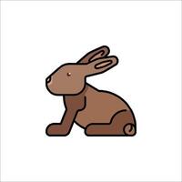 A brown rabbit sitting on the ground vector