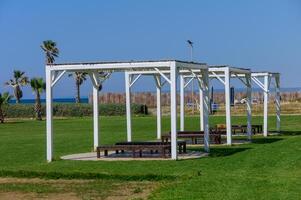 Sunshade Canopies with Beach Loungers at Resort photo
