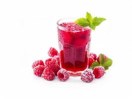 A glass of red raspberry juice with a sprig of mint on top photo