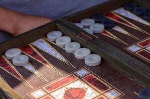Close-Up of Backgammon Game Board with Checkers and Dice photo