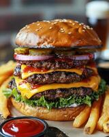 Indulging in a towering burger feast with crispy fries and refreshing beverages. photo