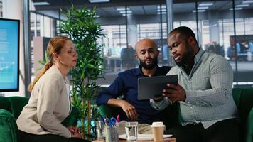 Group of empowered company leaders discuss corporate performance metrics, driven by vision and global investment strategy. International diverse business partners in conference. Camera B. video
