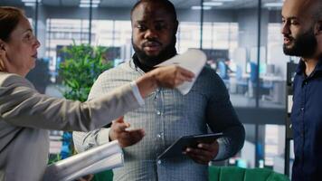 Diverse team of associates engaging in decision making and corporate leadership activities with a focus on foresight and negotiation. Multicultural business development. Camera B. video