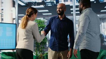 Multicultural group of CEOs welcoming each other in a negotiations meeting, discussing latest details for a new successful partnership between their international corporations. Networking. Camera B. video