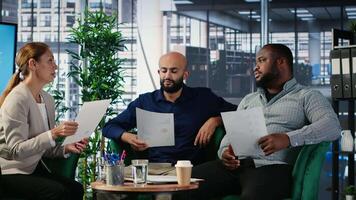 Woman business leader interrupting a meeting for an insightful phone call, discussing some important details on the telephone line. Diverse ambitious CEOs during a conference. Camera B. video