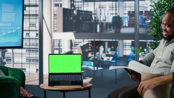 Empowered business CEOs discussing financial strategy with green screen and planning a global partnership between their corporations. Diverse leadership skills and work environment. Camera B. video