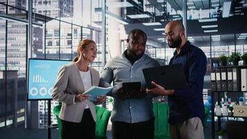 Diverse business CEOs meeting to discuss a new partnership between international firms, analyzing performance metrics and insights before decision making activities. Forecast. Camera A. video