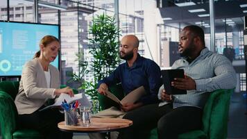 Multiethnic leaders meeting in office to establish financial forecasting, creating a business strategy for the new collaboration. Powerful people ensure goal oriented opportunity. Camera A. video