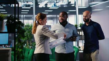 Diverse team of associates engaging in decision making and corporate leadership activities with a focus on foresight and negotiation. Multicultural business development. Camera A. video