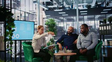 Corporate professionals discussing global market trends in boardroom, sharing expertise and performance metrics. Building a success story through planning and strong leadership skills. Camera A. video