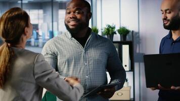 Business professionals shaking hands and reaching an agreement after the meeting, exchanging a handshake and giving their consent. CEOs making an alliance for global growth. Camera B. video