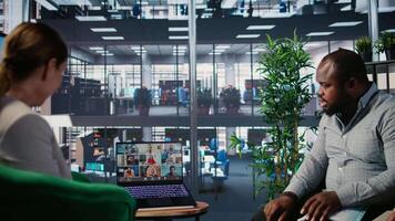 Diverse group conducting online business meeting using web conference tools to discuss collaboration agenda and corporate development. Powerful people chat on call. Camera A. video