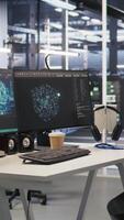 Vertical Data center workstation equipped with machine learning software visualizing deep learning models. High performance computers in server room running artificial intelligence code video