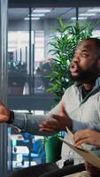 Vertical Office life showing frustration and dispute during a business discussion, with leaders are facing disagreement and workplace tension in a multicultural goal oriented company. Camera B. video