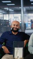 Vertical Corporate meeting where multicultural partners collaborate through call, applying strategic thinking and teamwork to align goals and support career and company success. Camera B. video