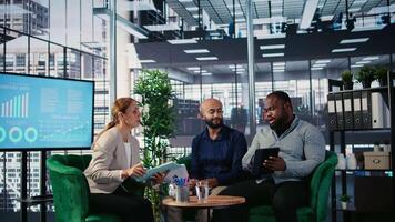 Multicultural business leaders sharing expertise and developing a strategy through collaboration and partnership in a corporate environment. CEOs networking in office space. Camera A. video