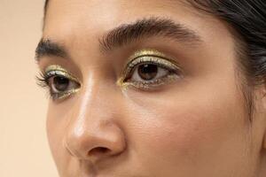 Captivating gaze with shimmering golden highlights enhancing natural beauty photo