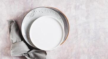 Diet and fasting concept, empty plates on light top view web banner photo
