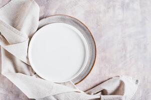 Diet and fasting concept, empty plates on light top view photo