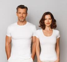 Smiling couple in matching white T-shirts. photo