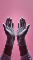 Two hands of doctor reaching upward from the top of the frame palms gently open as if ready to receive or support photo