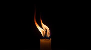 Candle Flame on Dark Background photo