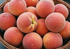 Ripe Peaches in Woven Basket photo