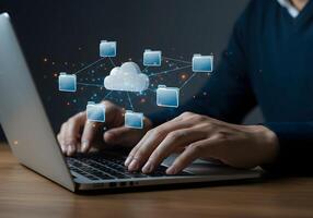 Cloud Network with Person Typing on Laptop photo
