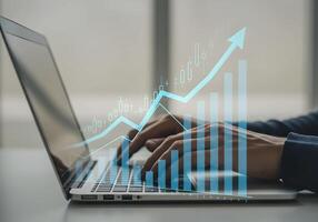Laptop and Growth Chart on Screen photo