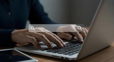 Typing on Laptop with Search Bar. photo