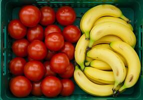 Tomato and Banana in Green Crate. photo