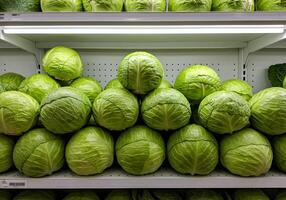 Fresh Green Cabbage Displayed on Shelf photo