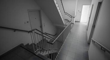 Stairwell with Doors and Railing photo