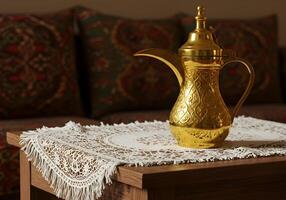 Golden Arabic Coffee Pot Displayed on Table with Lace Doily photo