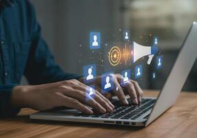 Online Communication on Laptop with People Icons and Megaphone photo