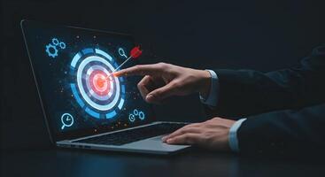 Target on Laptop Screen with Arrow and Hand photo