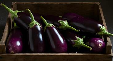 Fresh Eggplant in Wooden Crate photo