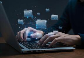 Laptop User with Floating Folder Icons photo