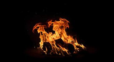 Burning Fire at night with dark background photo
