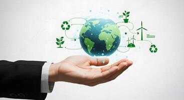 Earth in Hand with Ecology Symbols photo