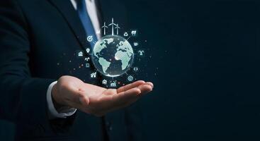 Globe Held by Hand with Technology and Renewable Energy Icons photo