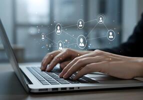 Hands Typing on Laptop with Social Network Connection photo