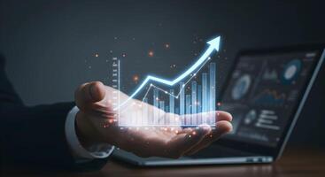 Growth Chart on Hand with Laptop photo