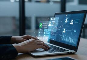 Person Uses Laptop for Application Tracking System photo