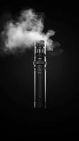 Monochrome image of a vaping device emitting vapor against a black background, creating a dramatic and stylish effect. Vaping concept photo