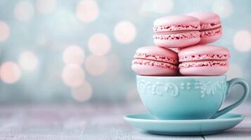 Pastel pink macarons in charming teacup, against dreamy bokeh background with soft lights, creating delightful dessert scene. Sweet treat concept photo